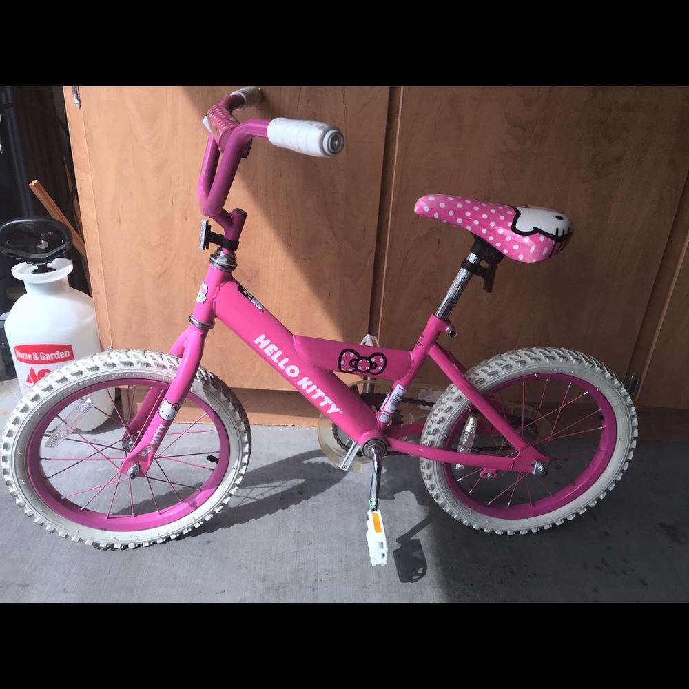 16 G Hello kitty bicycle & Doc McStufins scooter.